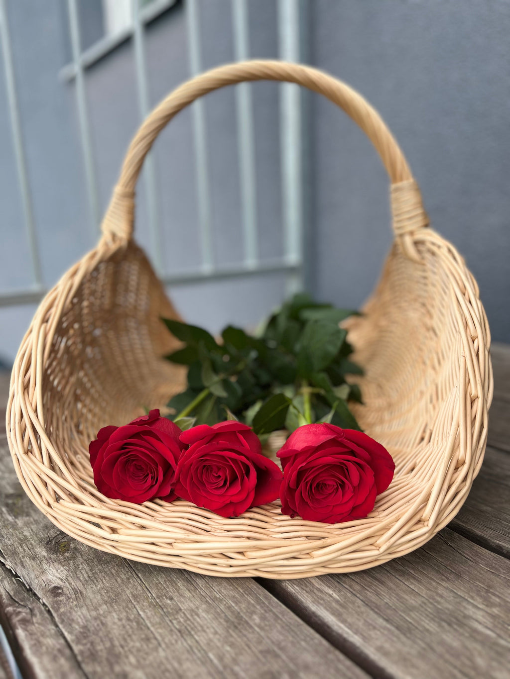 Large Wicker Flower Basket — handle and rim detail
